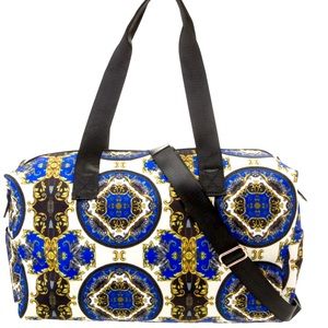 NWT- Alice + Olive weekender bag. Blue canvas printed with gold hardware.